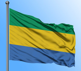 Gabon flag waving in the deep blue sky background. Isolated national flag. Macro view shot.