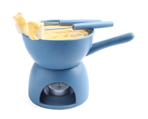 Pot of delicious cheese fondue and fork with bread on white background