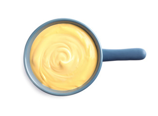 Pot with delicious cheese fondue on white background, top view