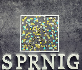 Poster concept. On a dark background the inscription about springtime.
