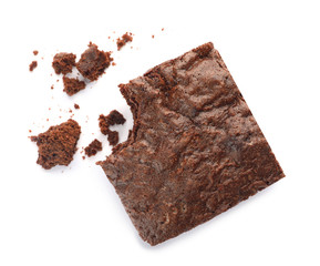 Piece of fresh brownie on white background, top view. Delicious chocolate pie