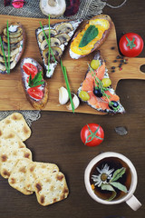 Assorted sandwiches with different fillings, fish mushrooms and others