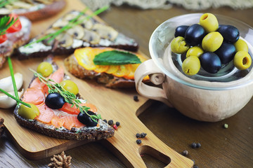 Assorted sandwiches with different fillings, fish mushrooms and others