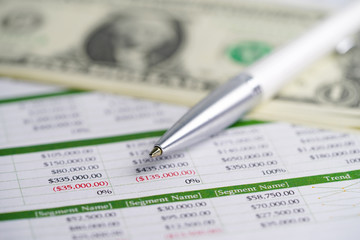 Obraz premium Spreadsheet table paper with pen. Finance development, Banking Account, Statistics Investment Analytic research data economy, trading, Mobile office reporting Business company meeting concept.