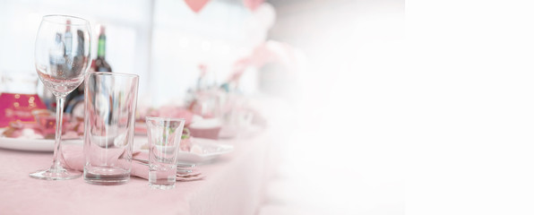 Glasses on the table in the restaurant. Table setting.