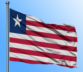 Liberia flag waving in the deep blue sky background. Isolated national flag. Macro view shot.