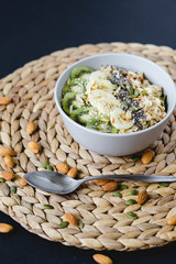 healthy Breakfast of oatmeal with fruit on a wicker napkin and almond