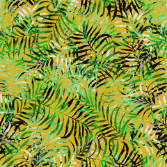 tropical leaves with light green and gray texture on an orange background