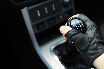 Gear lever. Manual Transmission. Hand on the gear shift in a car.