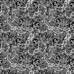 a dark background with flowers drawn in folk style in black and white colors