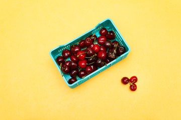 group of red fresh Cherry fruit on blue basket