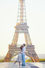 Fototapeta na wymiar Happy romantic couple in Paris, near the Eiffel tower