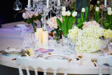Beautiful table set with candles and flowers