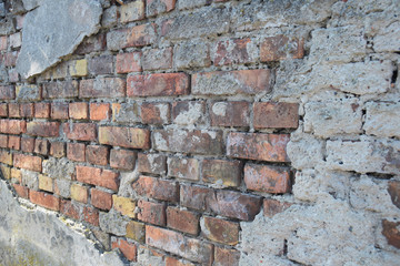 Fototapeta premium destroyed old brick in the old wall