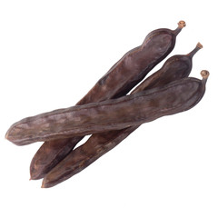 heap of carob isolated on white background