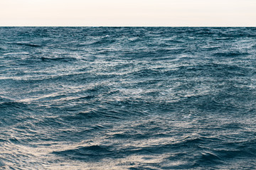 dark blue sea water background, waves of blue in black sea
