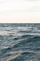 dark blue sea water background, waves of blue in black sea