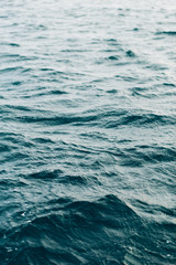 Fototapeta premium dark blue sea water background, shades of blue in black sea