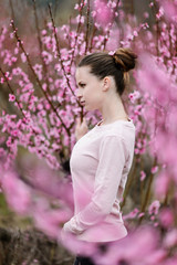 Beautiful girl in amazing dress in the gardens