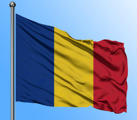 Romania flag waving in the deep blue sky background. Isolated national flag. Macro view shot.