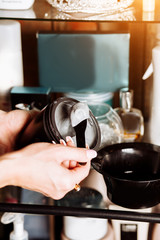 Cosmetologist applying mask on client's face in spa salon