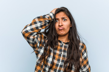 Young cool indian woman being shocked, he has remembered important meeting.