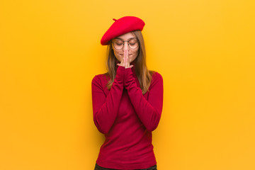 Naklejka premium Young french artist woman praying very happy and confident