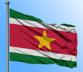 Suriname flag waving in the deep blue sky background. Isolated national flag. Macro view shot.