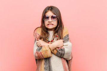 Little hippie girl going cold due to low temperature or a sickness.