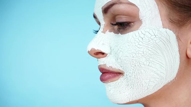 Girl with dry white mud mask on face