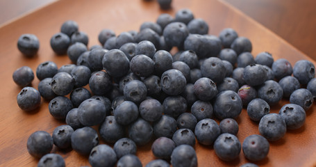 Stack of blueberry on the wooden plate
