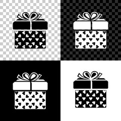 Gift box and heart icon isolated on black, white and transparent background. Packaging Valentine's Day. Beautiful festive box tied with ribbon and bow on top. Vector Illustration