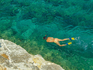 Young woman snorkeling.