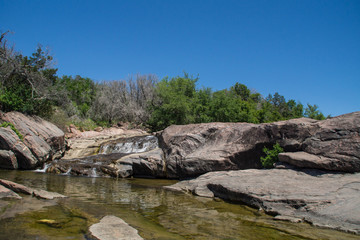 Water cascade of Colorado river in Inks Lake State Park, Texas