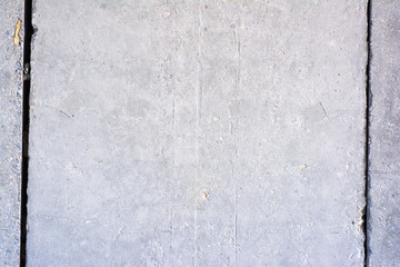 White painted old concrete wall with a wide crack