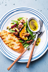 Salad - arugula (rucola), halloumi cheese, beetroot, walnuts and toast
