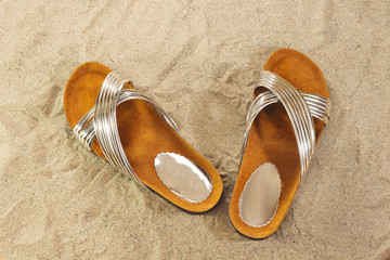 summer slippers on sand, summer concept