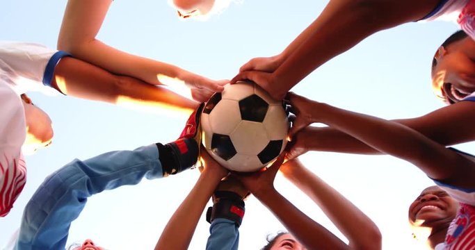 Low angle view of diverse female soccer team