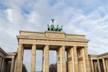 Famous neoclassical Brandenburg Gate (Brandenburger Tor) in Berlin, Germany, on a sunny day.