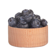 heap of blueberry in wooden cup isolated on white background
