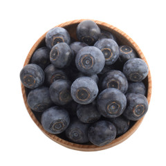 heap of blueberry in wooden cup isolated on white background. top view
