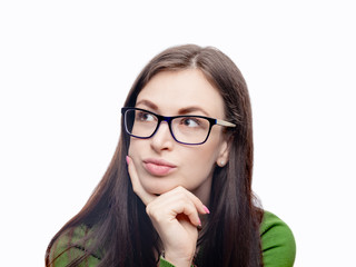 Young woman portrait. Pretty model in eyeglasses and green blouse looking aside of camera. Head shot. Studio image isolated on white. 