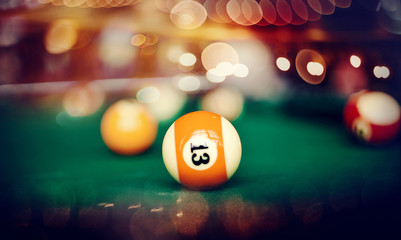 Billiard ball with number thirteen.