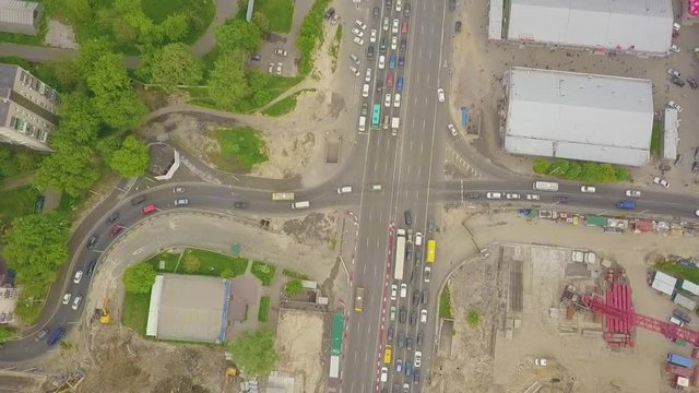 Aerial high drone flight over evening road traffic