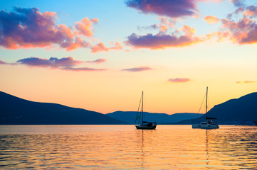 Beautiful purple sunset at Kotor bay, Tivat, Montenegro. Summer seascape, travel destination