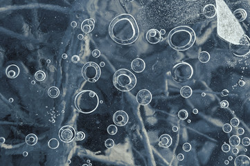 Texture abstract closeup background ice with bubbles of air caught by frost in the mass of water...