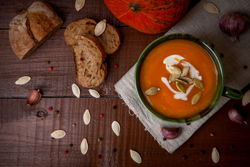 Pumpkin soup on wooden