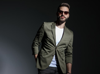 Charming man holding his hand in his back pocket