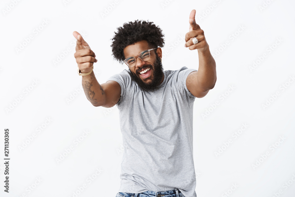 Wall mural you rock man. portrait of joyful good-looking emotive dark-skinned guy with afro hairstyle and beard