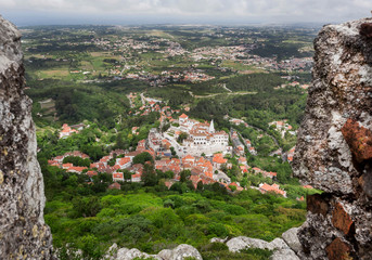 Fototapeta na wymiar Aerial view on Sintra streets with green trees, tile roofs. historical brick houses, Portugal